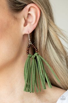 A trio of green suede tassels are knotted in place at the bottom of a wooden beaded frame, creating an earthy fringe. Earring attaches to a standard fishhook fitting. Cheap Green Beaded Tassel Earrings, Cheap Green Dangle Tassel Earrings, Cheap Elegant Green Tassel Earrings, Affordable Green Tassel Earrings For Summer, Green Tassel Earrings For Summer, Cheap Green Tassel Jewelry, Trendy Fringe, Beaded Frame, Fringe Earring