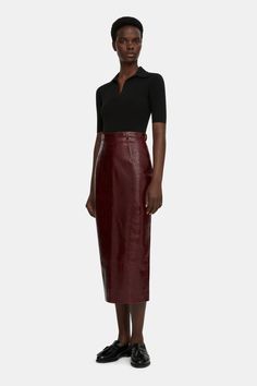 The Lorelei pencil skirt follows the Emilia Wickstead feminine tailoring, constructed from a supple leather in an oxblood tone. The Lorelei pencil skirt it cut to a high waist and is finished with a vent at the back. this skirt exudes sophistication and grace, offering both style and comfort for any occasion. Sleek Leather Pencil Skirt, Fitted Leather Pencil Skirt In Modern Style, Fitted Modern Leather Pencil Skirt, Modern Fitted Leather Pencil Skirt, Leather Knee-length Pencil Skirt For Work, Leather Pencil Skirt For Work, Chic Leather Pencil Skirt For Formal Occasions, Chic Leather Pencil Skirt For Work, Sleek Leather Pencil Skirt With Lining