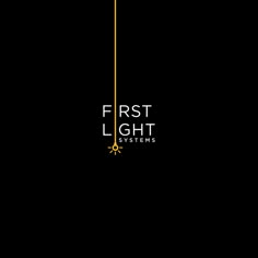 the first light systems logo is shown on a black background with gold trimmings