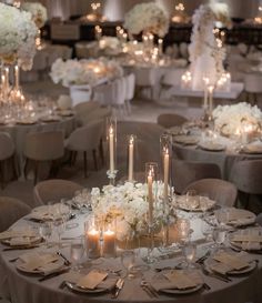 the tables are set with candles and centerpieces for an elegant wedding reception at the four seasons resort