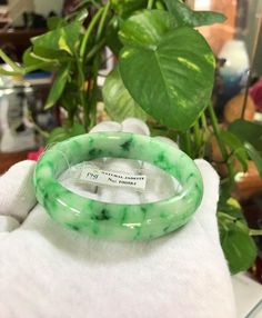 Vintage Translucent Natural Floral Green, White Jade Jadeite Bangle Bracelet ....Total of weights 52.7grams...( 260.66ct ) Measure inside 55.06MM ( 2 2/8'' Inches ) W 14.39MM ...It's in very good condition. The bangle come with CERIFICATE PNJ 100584 Lot #07 Green Natural Stones Crystal Bangle Bracelet, Green Bangle Crystal Bracelet With Natural Stones, Green Bangle With Natural Stones For Gift, Jade Bangle Bracelet, Vintage Bangle Bracelets, Jade Bangle, White Jade, Filigree Ring, Gold Wedding Band