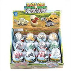 an assortment of dinosaur eggs in a cardboard box