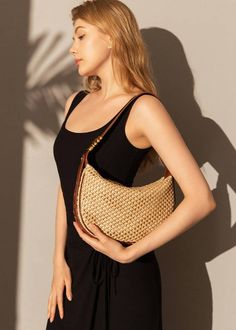 Indulge in luxury with our Woven Raffia Saddle Bag, expertly crafted with a blend of raffia and leather. Its adjustable shoulder strap ensures a perfect fit for women of all sizes. Elevate your style with this exclusive and elegant addition to your wardrobe. Size info 10 5/8" (27cm) width 6 3/4"(17cm) height 3"(8cm) depth Details Raffia and genuine cowhide leather Polyester lining Adjustable shoulder strap Interior wall pocket and zipper pocket Top zip closure Item #462501 Women's saddle shoulde Natural Color Hobo Shoulder Bag With Detachable Strap, Natural Hobo Shoulder Bag With Detachable Strap, Brown Crossbody Shoulder Bag With Bamboo Handle, Chic Satchel Straw Bag With Detachable Strap, Luxury Summer Shoulder Bag With Detachable Strap, Elegant Satchel Straw Bag, Elegant Woven Crossbody Bucket Bag, Beige Crossbody Straw Bag With Bamboo Handle, Natural Straw Bag With Detachable Strap For Everyday