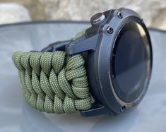 "FREE USPS PRIORITY MAIL SHIPPING FOR DOMESTIC US ORDERS (Includes U.S. Military APO/FPO Address Overseas) Thank you for visiting our shop \"Cording 2U\". A veteran owned business. Handcrafted Paracord wearables customized \"According To You\". Handcrafted with 100% Nylon Paracord \"MADE IN USA\" Our Products include: 🔹Custom handcrafted watch bands according to your wrist size, style, and color of choice. If you don't see it in our page yet, please contact us and we can discuss your options. ? Functional Green Watch Accessories For Outdoor, Functional Green Outdoor Watch Accessories, Durable Green Watch Bands For Outdoor, Paracord Watchband, Garmin Marq, Paracord Watch, Paracord Armband, Handmade Watch Bands, Garmin Fenix