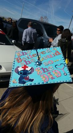 a person wearing a graduation cap with an elephant on it