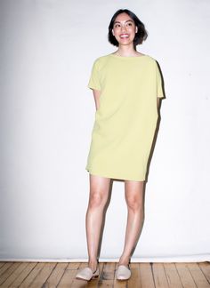 Angle Mini Dolman Open Back Dress - Avocado Chic Oversized Short Sleeve Dresses, Spring Daywear Dresses With Draped Sleeves, Chic Short Sleeve Dress With Button Back, Chic Short Sleeve Button Back Dress, Chic Oversized Mini Dress, Summer Daywear Dresses With Draped Sleeves, Elegant Oversized Mini Dress, Green Oversized Dress For Workwear, Green Oversized Dress For Work