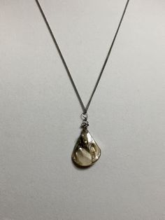 "Available in 16\", 18\" Sea shell pendant silver stainless stainless curb chain necklace, ornate with a 5mm silver plated alloy metal flower bead. Hand made jewelry! All purchase will arrive in gifts boxes. Thanks for stopping by!" Silver Shell Necklace With Pearl Pendant, Elegant Pendant Shell Necklace With Lobster Clasp, Elegant Shell Necklace With Lobster Clasp As Gift, Silver Mother Of Pearl Shell Jewelry, Silver Shell Jewelry With Lobster Clasp, Silver Shell-shaped Jewelry With Lobster Clasp, Metal Shell Necklace As A Gift, Metal Shell Necklace For Gift, Metal Shell Necklace Gift