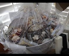 a basket filled with lots of clutter on top of a table