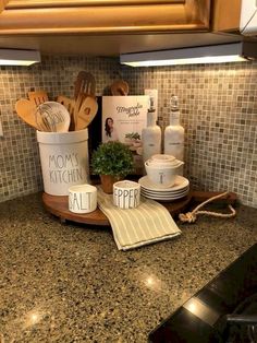 kitchen utensils and cookbooks are sitting on the counter