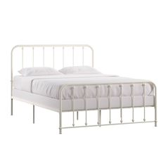 a white metal bed frame with two pillows on top of the headboard and foot board