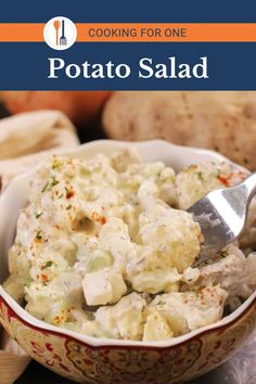 potato salad in a bowl with a spoon