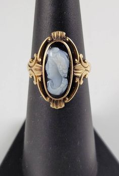 *Size 5.75-6-sizeable by your local jeweler, just mind the hallmarks! *Weighs-2.6 grams *Gorgeous, genuine, hand-carved Black & White Sardonyx Cameo set in solid 12KT Rose Gold. *The ring is amazing, & is designed like an ornate rose gold frame around a portrait. *Handmade ring with hand-carved detailing. *Dates from 1870-1890! A true Victorian Era Cameo Ring. *Stamped with 3 interlocking circles, the Maker's Mark for M.B. Bryant Jewelry Company. There are also three antique script initials carv Script Initial, Rose Gold Frame, Cameo Ring, Maker's Mark, Jewelry Companies, Black & White, Victorian Era, Victorian Fashion, Rings Statement