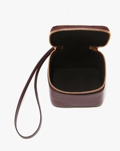 FINAL SALE The Vanity Micro Clutch in Burgundy by Victoria Beckham is a mini vanity case with a structured square silhouette with gold hardware, wristlet strap and zip fastening. 100% Calf Leather Made in Italy #B424AAC006124A Luxury Portable Box Bag For Formal Occasions, Luxury Square Box Bag With Zipper Closure, Rectangular Box Bag With Gold-tone Hardware As Gift, Victoria Beckham Bags, Cream Converse, Mini Vanity, Micro Bag, Structured Bag, Converse Chuck 70