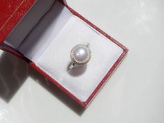 Hallmarked Open Pearl Ring As Gift, Hallmarked Open Pearl Ring For Gifts, Round Halo Pearl Ring For Gift, Round Halo Pearl Ring As A Gift, White Pearl Halo Ring For Gifting, White Pearl Halo Ring For Gift, Pearl Ring With Halo For Gift, White Pearl Halo Ring As Gift, Round Pearl Ring With Halo For Gift