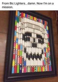 a photo frame made out of crayons and pens