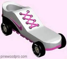 a white and pink toy car with black wheels