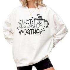 Hot Chocolate Weather Sweatshirt, Cute Christmas Shirt, Trendy Christmas Sweater For Women, Winter Holiday Crewneck, Christmas Gift For Her ---------- Ordering Your Custom Design T-shirt: Step by Step ---------- 1. Select your preferred t-shirt color. 2. Specify your desired size. 3. Pick the color for both your design and text. 4. Ensure that each step of your order is accurately completed. M A T E R I A L S → Our solid color options such as White and Black consist of 100% Cotton. → The Heathered Colors are a blend of cotton and polyester, ensuring a luxuriously soft feel. → Crafted as Short Sleeve Crew-Neck Unisex T-Shirts. → Composed of soft, high-quality Sueded Jersey fabric. → Pre-shrunk for lasting fit. → Taped shoulder-to-shoulder for enhanced durability. → Tear away label for added Sweater For Women Winter, Hot Chocolate Weather, Christmas Sweater For Women, Holiday Crewneck, Cute Christmas Shirt, Cute Christmas Shirts, Christmas Sweaters For Women, Sweatshirt Cute, Sweater For Women