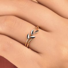 The design of this ring, adorned with delicate branches and leaves that wrap around your finger, is inspired by the graceful olive branch. It is unique and eye-catching with sparkling cubic zirconia stones on the leaf parts. It can be stacked or used alone. RING DETAILS ♥ Gold Karat: 14 karat Solid Gold ♥ Stones: AAA Cubic Zirconia ♥ Our products are hallmarked "14K" or "585". ♥ Ring Band Color Available; White, Yellow, Rose Gold ♥ Ready to Ship 2-3 Working Days ♥If you would like this ring in 10k or 18k gold, please message me for the price. 🎁 PACKAGING Each item comes in a premium gift jewellery box and wrapped beautifully as a gift. If you would like us to include a gift note in the parcel, please leave us a message with your order about the content of the note. We would love to prepar Minimalist Gold Rings Aesthetic, Leaf Parts, Olive Branch Ring, Thick Gold Ring, Gold Twigs, Gold Leaf Rings, Leaf Engagement Ring, Branch Ring, Jewelry Birthday