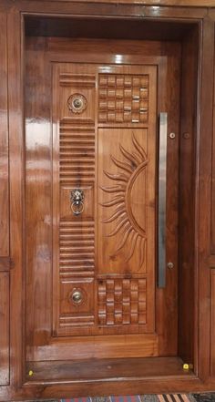 a wooden door with an intricate design on it