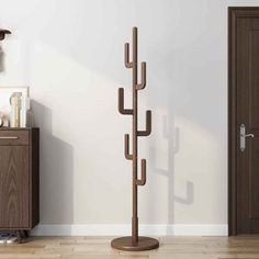 a coat rack in the corner of a room