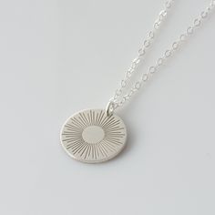 "Our sunshine Necklace is sure to brighten your day! A wonderful addition to our Sun/Moon/Stars Collection, our sun disc necklaces are great for layering, a wonderful minimalist piece, perfect gift for your wife, girlfriend or simply to treat yourself! Engraved and hand assembled with care and love, it comes in 14k gold fill, rose gold fill, or sterling silver. HOW - TO - ORDER 1. Select your options from the drop down menu see photo for font styles and symbol options 2. Chain length options are Minimalist Etched Necklaces For Everyday Wear, Minimalist Etched Necklaces, Minimalist Everyday Etched Necklaces, Minimalist Everyday Etched Necklace, Silver Sunburst Necklace For Gift, Silver Sunburst Jewelry For Gifts, Gold Sun Necklace, Sunburst Necklace, Necklace Sun