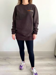 This unisex crew neck sweatshirt is a great piece to dress up for down. The relaxed silhouette allows you to have that laid back look without it being too big. Featuring the subtle logo embroidered on the chest, this deep chocolate sweatshirt can always match your style. Minimalist sweatshirts never go out of style and this super soft, cosy one will be perfect for relaxing, walking the dog or pairing with jeans for a day out! Even better, its available in size XS - XXL 350 G/M2 85% recycled cotton 15% recycled polyester GOTS certified Model is a size UK 8 and wears a medium for an oversized fit Aesthetic Sweatshirt, Gift Aesthetic, Trendy Gift, Dog Walking, Out Of Style, Recycled Cotton, Logo Embroidered, Unisex Sweatshirt, Dark Brown