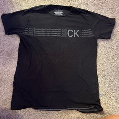 This Super Cute Tee Has Been Worn A Few Times And Has A Little Fading But Before I’ll Ship I’ll Treat It And It Will Look Brand New!!! Fitted Calvin Klein Casual T-shirt, Calvin Klein Short Sleeve Streetwear Top, Calvin Klein Black T-shirt For Streetwear, Fitted Calvin Klein Short Sleeve T-shirt, Fitted Short Sleeve Calvin Klein T-shirt, Black Calvin Klein Crew Neck T-shirt, Calvin Klein Black Crew Neck T-shirt, Calvin Klein Casual Short Sleeve Shirt, Casual Calvin Klein Short Sleeve Shirt