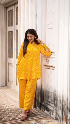 Slay this festive season in style! Bright Sunshine Yellow Bandhani Co-ord set made in Modal Silk Hand Tie Dyed Short Top + Pallazo set with closed neck Model height is 5.3” and is wearing a size S Loose Fit Wash Care : Dry Clean Only Festive Saree Set With Dabka Details, Eid Bandhani Print Blouse For Puja, Festive Eid Palazzo Set With Bandhani Print, Bollywood Style Long Sleeve Pant Set For Navratri, Saree Sets For Navratri Celebration, Navratri Celebration Saree Set, Festive Designer Bandhani Print Set, Festive Bandhani Print Palazzo Set For Diwali, Navratri Long Sleeve Palazzo Set With Self Design