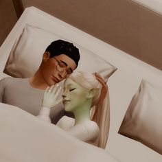 a man and woman laying in bed next to each other with their hands on the head