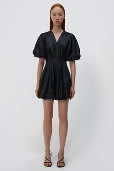 This dress by Jonathan Simkhai features a bubble hem, puffed short sleeve, pin tucking at waist, and v neckline. Fit: This dress fits true to size Color: Black Origin: Imported Balloon Dress, Parsons School Of Design, Fashion Institute, Bubble Hem, Jonathan Simkhai, 2023 Collection, Lifestyle Design, New Launch, Vogue Fashion