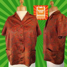 "A pretty little vintage blouse🤎 60's 60's handmade in a lovely silky tricel fabric in a mid brown/orangy tan and dark green Paisley design. ..boxy fit, revere collar, short sleeved, bust darts...2 patch pockets to front. Lovely square brown buttons. Handmade to a good standard.🤎 Meant to be worn untucked... 🤎 Fabulous vintage condition🤎 🤎💚approx modern UK 14💚🤎 (depending how you like the fit) 💚Flat pit to pit 42\"...best fit up to 38\" bust max 💚Flat waist 42\"...best fit 40\" waist max 💚Flat hip 44\". .best fit 42\" hip max 💚Nape to hem 22.5\" 💚Shoulder to shoulder 16.5\" ❤️❤️NO STRETCH at all to fabric so please check ALL measurements carefully prior to purchase as no returns❤️❤️ A very sweet blouse This is a pre-loved vintage item... I have tried to describe it as accurate Vintage Short Sleeve Blouse For Fall, Retro Fitted Brown Blouse, Fitted Retro Brown Blouse, Retro Orange Blouse For Fall, Fall Retro Blouse, Vintage Orange Tops With Retro Print, Fitted Brown Tops In 1970s Style, Vintage Orange Top With Retro Print, Vintage Brown Tops With Retro Print