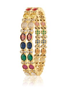 Elevate your look with the navratan silver bangle, crafted from 92.5 sterling silver and adorned with a vibrant array of Navratan stones and shimmering cubic zirconias. This bangle offers a colorful twist on classic elegance, adding a touch of luxury and cultural charm to any outfit. Multicolor Diamond Bangle Jewelry, Multicolor Diamond Bangle, Traditional Multicolor Cubic Zirconia Jewelry, Fusion Style Bangle Jewelry With Gemstone Accents, Elegant Multicolor Stone Bangle, Multicolor Stone Setting Bangle Jewelry, Multicolor Stone Setting Bangle, Gemstone Bangle For Festivals, Festive Gemstone Bangle As Gift