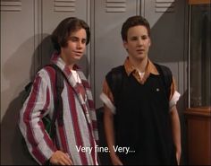 two young men standing next to each other in front of lockers with the caption very fine very