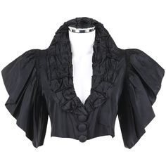 Vintage Jean Patou Adaptation c.1930's black silk capelet. Shawl collar with gathered piping detail. Three center front covered buttons over top snap closures. Short ruffled flounce sleeves. Center back vertical piping detail. Fully lined. Unmarked Fabric Content: Silk. Measurements: Shoulder: 14.25’’ (seam to seam) Sleeve: 7.5’’ (shoulder seam to cuff) Chest: 30’’ (armpit to armpit) Waist: 29’’(measured along hem) Total Length: 15" (center back to hem, excluding collar) Tshirt Upcycle, Wool Capelet, Beaded Flapper Dress, Dream Wishlist, Silk Cape, Clothing Reference, Jean Patou, Costume Inspo, Vintage Coats