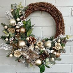 a christmas wreath hanging on a brick wall