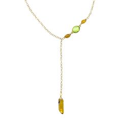 Expertly crafted with 14k gold filled material and gold quartz stones, this asymmetrical necklace exudes luxury. The unique design features an elephant charm on the back, adding a touch of whimsy. Perfect for everyday wear or special occasions, this necklace is a must-have for any fashion-forward individual. Gold Dangle Necklaces With Gemstone Accents, Elegant Lariat Crystal Necklace With Natural Stones, Elegant Citrine Necklace With Gemstone Accents, Elegant Yellow Faceted Necklaces, Elegant Citrine Jewelry With Natural Stones, Elegant Gold Citrine Necklace, Formal Yellow Gold Necklaces With Natural Stones, Elegant Citrine Gemstone Bead Necklaces, Gold Lariat Necklaces With Gemstone Beads