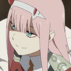 an anime character with pink hair and blue eyes