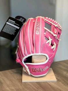 Baseball gloves Wilson A2000 Baseball Stuff, Pink Softball Aesthetic, Walk Up Songs Softball, Eye Black Softball, Custom Softball Gloves, Pink Baseball Bat, Softball Batting Gloves, Baseball Gloves, A2000 Softball Glove