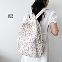 Why You'll Love It Introducing a floral symphony in canvas, a backpack where elegance meets utility. Blossoms bloom upon sturdy fabric, embodying nature's beauty and purpose. Explore its functional pockets, carrying the essence of gardens wherever you wander. Whether city streets or country paths, let the floral charm and practicality accompany your journey. Walk amidst petals and possibilities, as this canvas backpack transforms every outing into a graceful adventure. Features Material: Nylon,