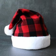 Christmas Hat, Xmas Hat Holiday for Adults Unisex Santa Hat For Party Supplies Features: --This hat is a great Christmas costume accessory and an everyday wear hat, you and your kids will love it. Perfect for most adults and teens to wear or share with others. --Soft to touch, comfortable to wear and safe material, keep your head warm in the cold winter months. --Beautiful colors that need to be hand washed, crafted to ensure this will last for many seasons and be able to be used for a long time Buffalo Check Christmas, Plaid Hats, Holiday Party Favors, Santa Claus Hat, Merry Christmas Decoration, Warm Christmas, Christmas Party Supplies, Holiday Party Decorations, Christmas Costumes