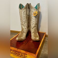 Corral Women's Overlay Embroidery Studs & Crystals Western Boots. Brand New With Tags And With No Signs Of Wear. Comes With Corral Boot Box. (Does Run A Little Big, Fits More Like A Size 8 In My Opinion) “Introducing The Dazzling Corral Women's Overlay Embroidery Studs & Crystals Western Boots - Where Refined Elegance Meets Rugged Western Style. Designed For The Modern Cowgirl Who Demands Both Luxury And Durability, These Exquisite Boots Showcase Your Unparalleled Taste And Exude High-Quality Cr Gold Western Boots With Almond Toe, Western Embroidered Beige Boots, Fitted Snip Toe Wedding Boots, Leather Snip Toe Wedding Boots, Leather Wedding Boots With Snip Toe, Wedding Leather Boots With Snip Toe, White Leather Boots For Wedding, Wedding Cowboy Boots, White Overlay