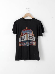 a t - shirt hanging on a hanger with the words, world's fairground