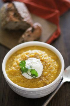 a bowl of soup with sour cream on top