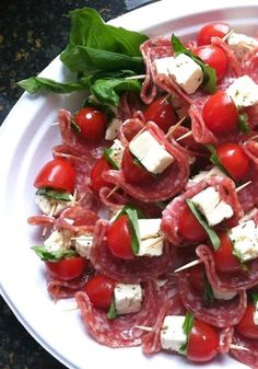 a white plate topped with meat and veggies