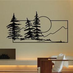 a wall decal with trees and mountains in the background