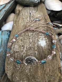 "Here is a lovely sea inspired anklet. The colors are so pretty together and the colors will remind any beach lover of the sea. This makes a perfect gift for yourself, friend or loved one:) Pictured is a hand knotted macrame style sand dollar anklet designed on waterproof polyester cord in beige with small turquoise and clear glass and light pink pearls. I allow about 3\" to 4\" extra inches so you can slide your anklet easily over your foot and it closes with an adjustable slide knot; no clasps Beach Anklets With Adjustable Length, Adjustable Beaded Beachy Anklets, Adjustable Anklets As Gifts For Beach Season, Bohemian Beach Anklets With Sliding Knot, Bohemian Adjustable Anklets For Beach, Bohemian Anklets With Sliding Knot For Beach, Bohemian Sliding Knot Anklet For Beach, Adjustable Sand-colored Bohemian Jewelry, Adjustable Bohemian Sand-colored Jewelry