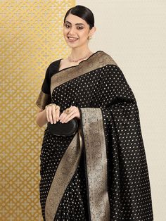 Black banarasi sareeEthnic motifs woven design saree with woven design borderHas zari detailThe saree comes with an unstitched blouse pieceThe blouse worn by the model might be for modelling purpose only. Check the image of the blouse piece to understand how the actual blouse piece looks like. Black Pre-draped Saree With Zari Weaving In Art Silk, Black Banarasi Silk Pre-draped Saree With Pallu, Black Pre-draped Saree With Zari Weaving For Puja, Black Banarasi Silk Anarkali Blouse Piece, Black Banarasi Silk Pre-draped Saree With Self Design, Formal Chanderi Pre-draped Saree With Zari Weaving, Black Pre-draped Saree With Zari Weaving, Black Banarasi Silk Saree For Eid, Black Saree Blouse With Zari Weaving