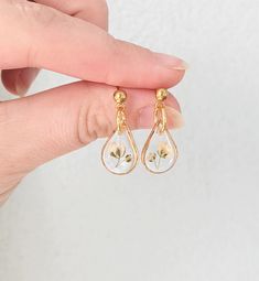 Pressed flower earrings, new mom gift, dried flower jewelry, handmade resin dangle earrings, tiny baby's breath studs, ball stud earrings, teardrop jewelry, gold, silver, nature earrings for women, white flower earrings, bridal jewelry, memorial earrings, stillbirth gift, dainty handmade resin earrings, gypsophila, white flower earrings, elegant, classy, small, incredibly lightweight These tiny teardrop dangle earrings are handmade and feature real baby's breath flowers encased in resin. Availab Delicate White Teardrop Flower Earrings, White Teardrop Flower Earrings, White Teardrop Hypoallergenic Flower Earrings, Delicate White Teardrop Earrings, Delicate Teardrop Earrings, Dainty Pressed Flower Earrings, White Teardrop Jewelry With Pressed Flowers, Dainty White Earrings With Pressed Flowers, Dainty White Pressed Flower Earrings