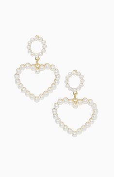 Online only! Be the envy of your next party with the Ettika Loving Pear Heart Earrings. These elegant drop earrings feature a heart shape with a pearl design and gold accents. Drop earrings 18K gold plated, zinc, acrylic, pearls 1.95" length x 1.3" width Steel post back closure Ettika Womens Loving Pearl Heart Earrings - Gold Heart Jewlery, 2000s Earrings, Pearl Jewlery, Pearl Heart Earrings, Heart Accessories, Pearl Heart, Heart Shaped Earrings, Steel Post, Pearl Design