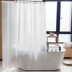 a white bath tub sitting next to a window